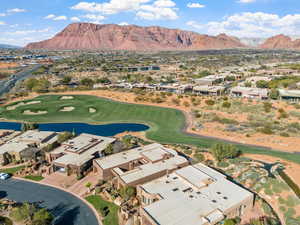 Birds eye view of property featuring a water and mountain view