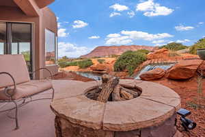 View of patio / terrace with a mountain view and a fire pit