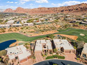 Birds eye view of property featuring a water and mountain view