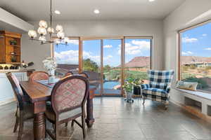 Dining room featuring a mountain view and a chandelier