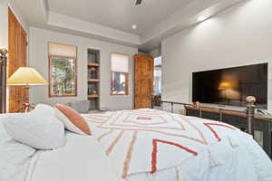 Bedroom with a raised ceiling