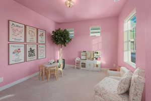 Game room featuring a wealth of natural light and carpet flooring