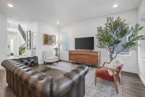 Living room with hardwood / wood-style floors