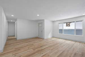 Spare room with light hardwood / wood-style flooring