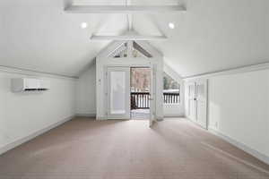 Bonus room featuring a wall mounted air conditioner, lofted ceiling with beams, and carpet