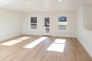 Spare room featuring light hardwood / wood-style floors