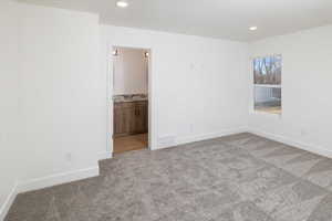 View of carpeted spare room