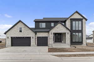 View of front of property with a garage