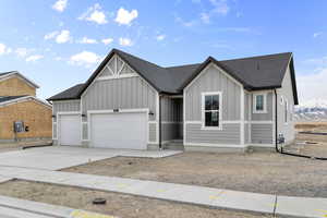 View of front of house featuring a garage and a mountain view