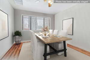 Photo has been virtually staged. This room can easily be turned back into a dining room like this.