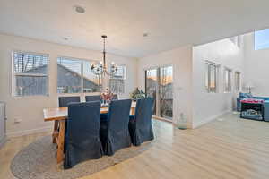 Dining area featuring light hardwood / wood-style flooring and a chandelier