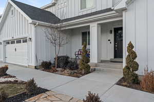 View of exterior entry featuring a garage