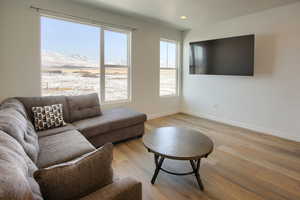 Living room with light hardwood / wood-style flooring