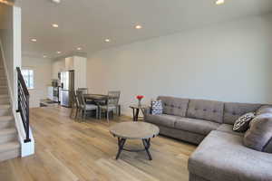 Living room with light wood-type flooring