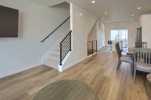 Dining room with sink and light hardwood / wood-style flooring