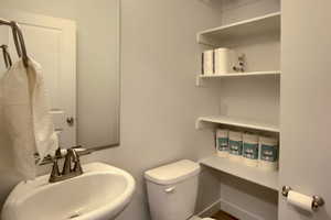 Bathroom featuring sink and toilet