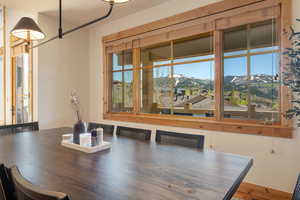 Dining area featuring plenty of natural light and a mountain view