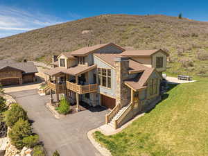 View of subject property with a mountain backdrop