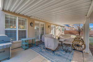 View of patio featuring a grill