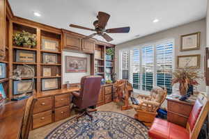 Office area featuring ceiling fan