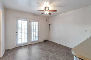 Empty room featuring ceiling fan