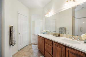 Bathroom with tile patterned floors and vanity