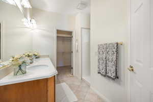 Bathroom with vanity and tile patterned flooring