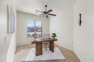 Office featuring ceiling fan and light colored carpet