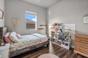 Bedroom featuring dark wood-type flooring