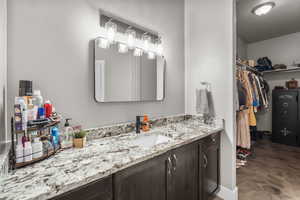 Bathroom with tile patterned flooring and vanity