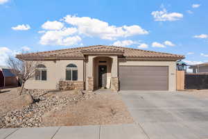 View of front of home featuring a garage