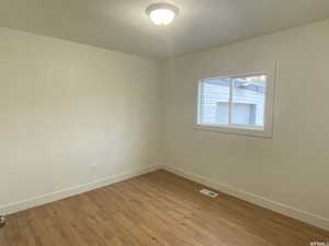 Spare room with light hardwood / wood-style floors