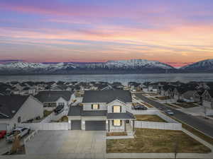 Aerial view at dusk with a water and mountain view