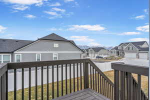 Wooden deck featuring a lawn