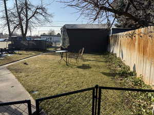 View of yard featuring a storage unit