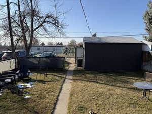 View of yard with a storage unit