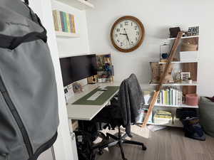 Home office with hardwood / wood-style flooring