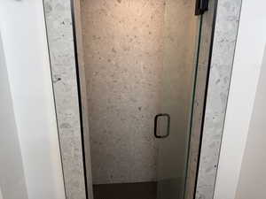 Details featuring a shower with shower door