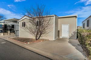 View of front of home with a carport