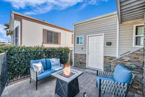 View of patio / terrace featuring an outdoor living space with a fire pit