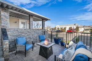 View of patio / terrace with an outdoor living space with a fire pit