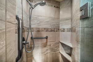 Bathroom featuring a tile shower