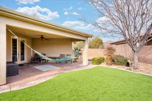 View of yard with a patio and ceiling fan