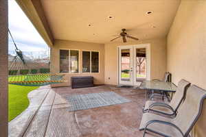 View of patio with ceiling fan and french doors