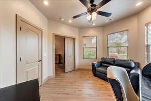 Interior space featuring ceiling fan and light hardwood / wood-style flooring