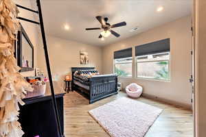 Bedroom featuring ceiling fan and light wood-type flooring