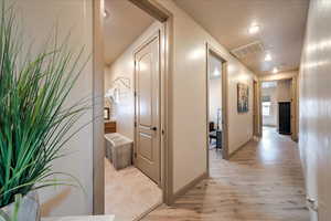 Hallway featuring light hardwood / wood-style flooring