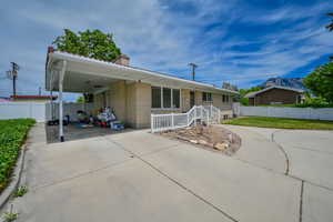 View of front of property featuring a carport