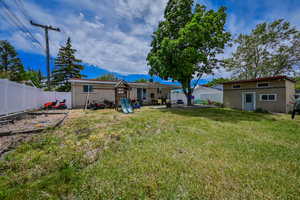 View of yard with an outbuilding and a playground