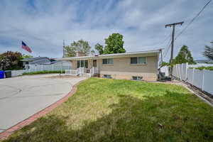 Ranch-style home with a front yard